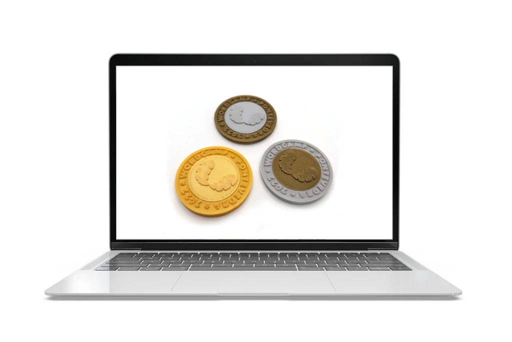 pantalla de pc con fotografía de las monedas impresas en 3D de la WordCamp de Pontevedra